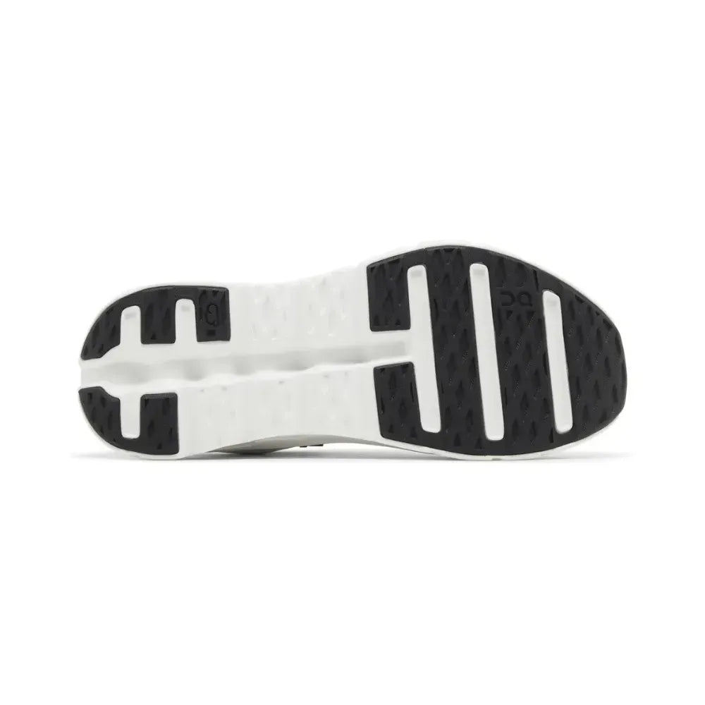 Sola de tênis esportivo branco com detalhes em preto, vista inferior, design antiderrapante.