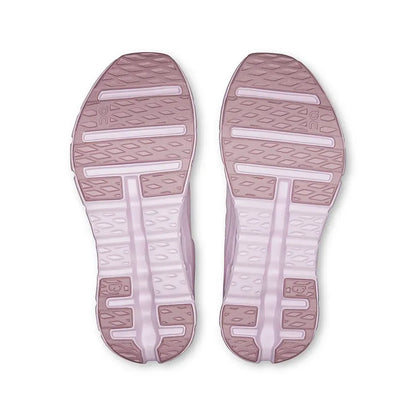 Sola dos tênis esportivos rosa claro com detalhes texturizados e design antiderrapante.