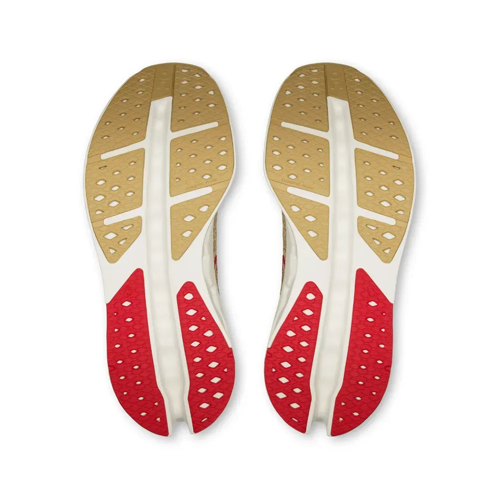 Solado de tênis esportivo premium nas cores bege e vermelho, design respirável e moderno.