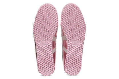 Solado de tênis rosa claro com textura quadriculada e detalhe central em relevo