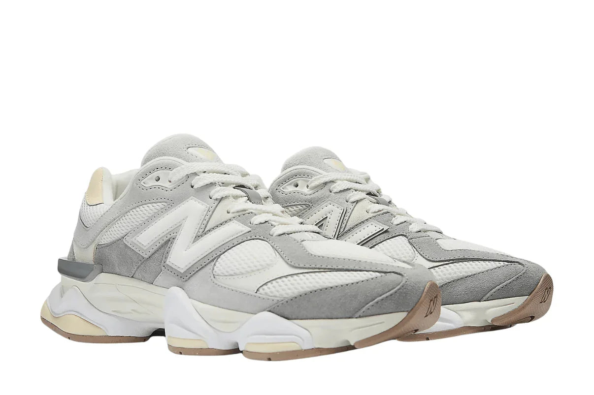 Tênis casual masculino cinza e branco com detalhes em mesh, sola robusta e visual moderno