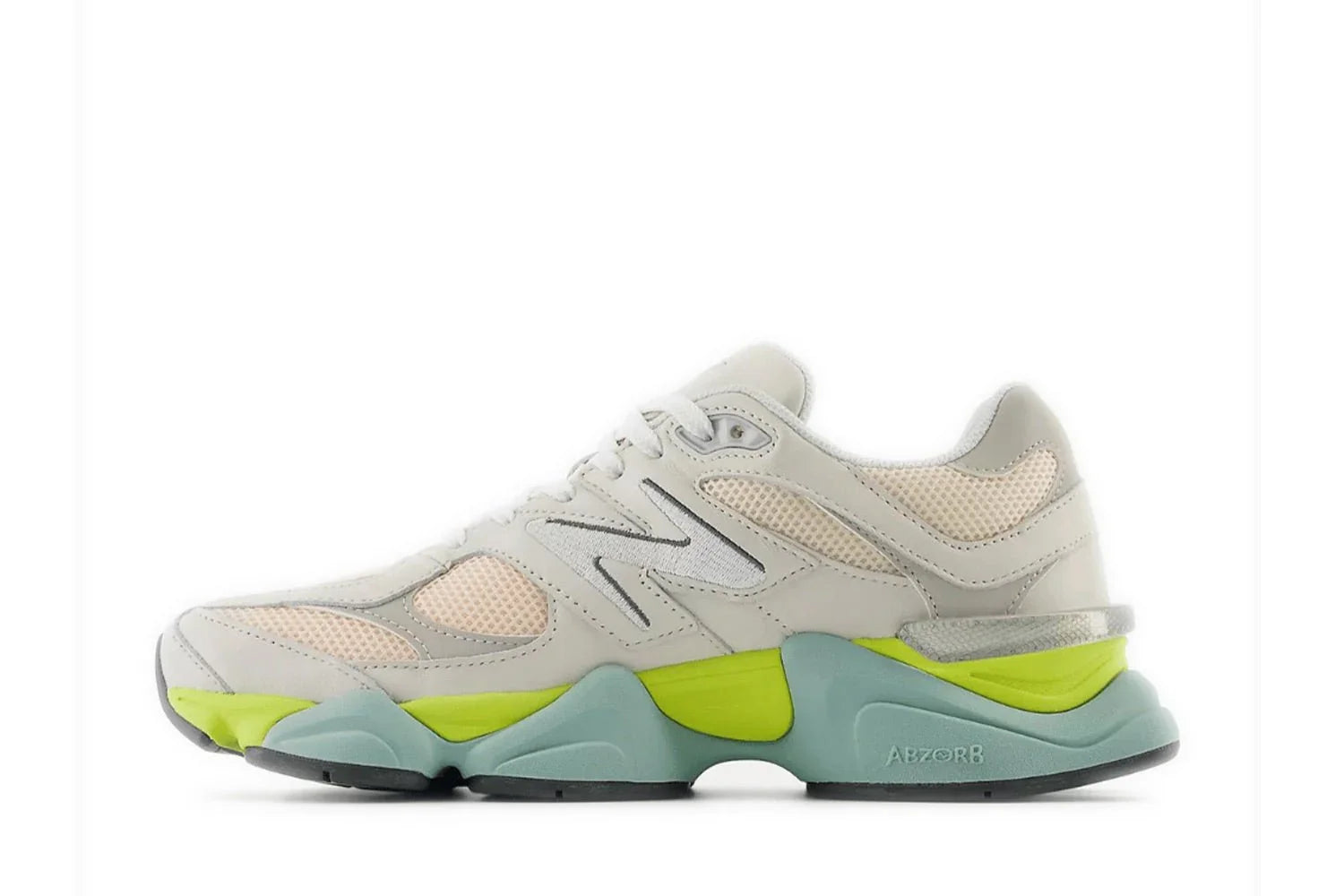 Tênis casual masculino em mesh bege com detalhes verde limão e sola robusta New Balance 9060.