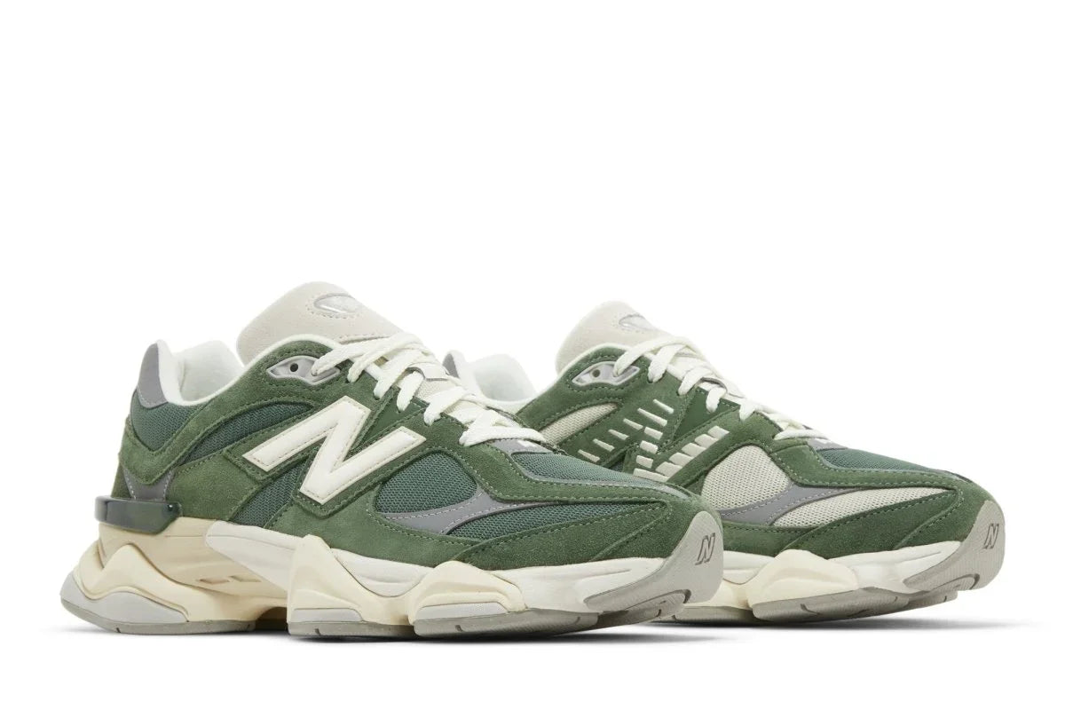 Tênis verde New Balance 9060 com detalhes em branco e bege, design moderno e sola robusta.