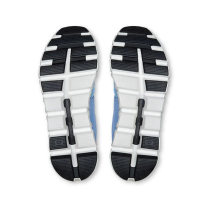 Sola dos tênis esportivos azul On Running Cloud 6 com detalhes em preto e branco em close.