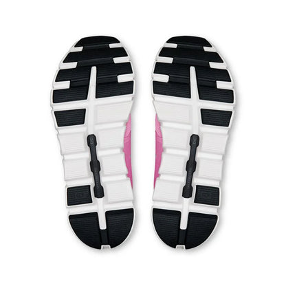 Solado de tênis esportivo rosa com detalhes em preto e branco visto de baixo.