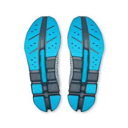 Sola de tênis esportivo cinza e azul com detalhes texturizados, vista inferior