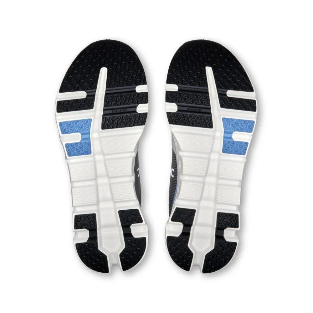 Solado de tênis esportivo cinza com detalhes azul celeste, design antiderrapante moderno.