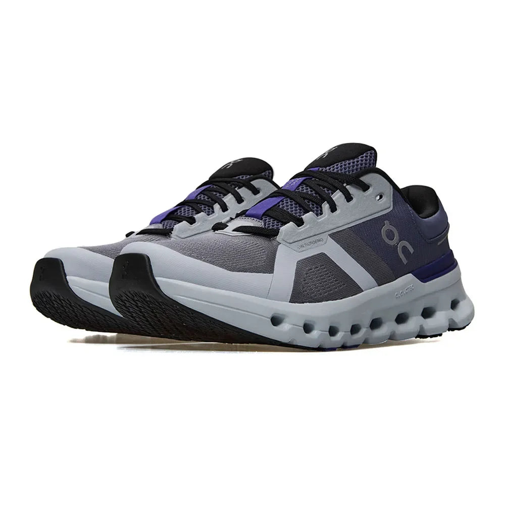 Tênis esportivo masculino cinza e azul, solado robusto, design moderno, detalhes em malha.