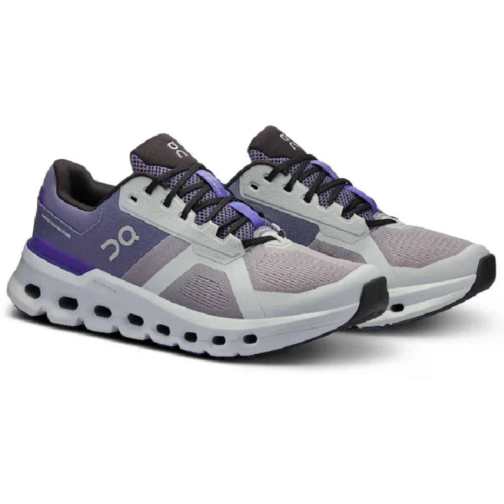 Tênis esportivo cinza e roxo com sola robusta e detalhes respiráveis, perfil lateral.