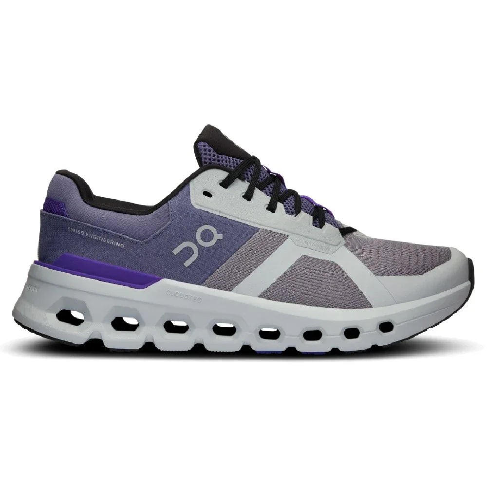 Tênis esportivo cinza e roxo com solado robusto e detalhes em preto, lateral destacada.