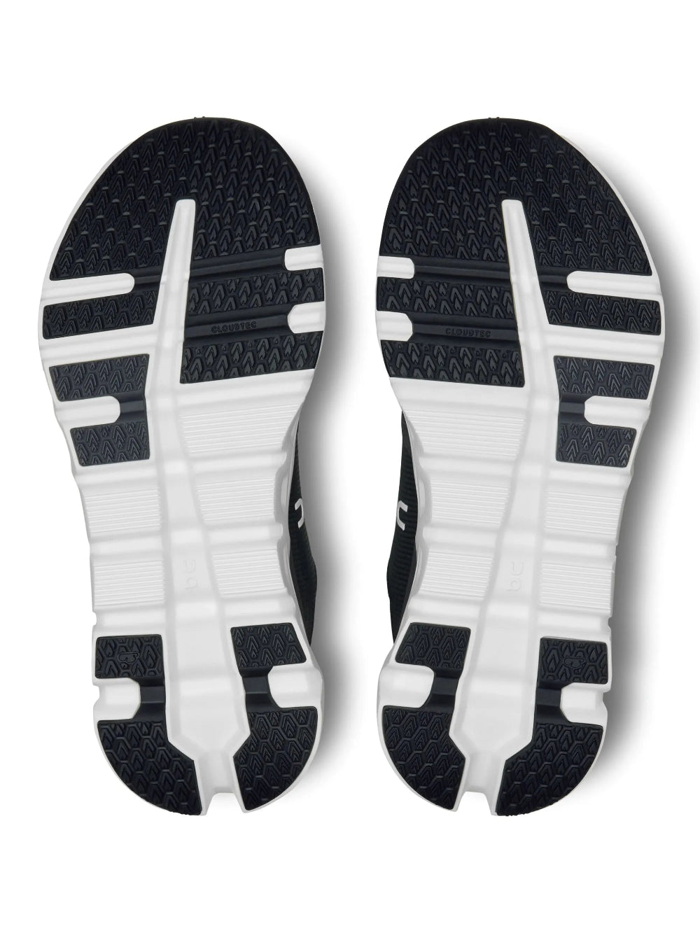 Solado do tênis On Running Cloudrunner 2 preto e branco com base estruturada e elementos vazados característicos