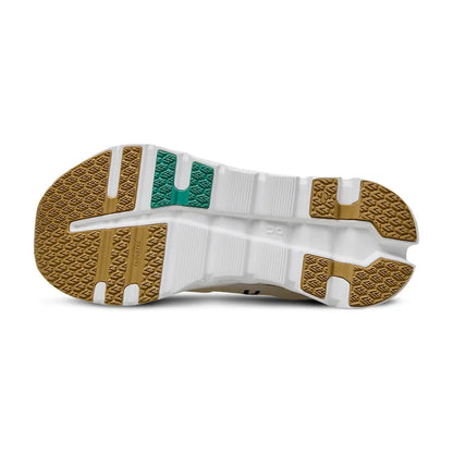 Solado do tênis esportivo branco com detalhes verde e bege, visual esportivo e moderno.