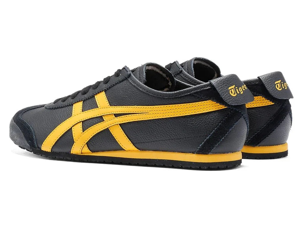 Tênis preto com detalhes amarelos, modelo clássico, visual esportivo retrô, vista lateral e traseira