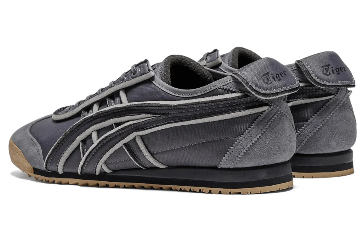 Tênis casual cinza escuro com detalhes em suede, sola emborrachada e logo na língua.